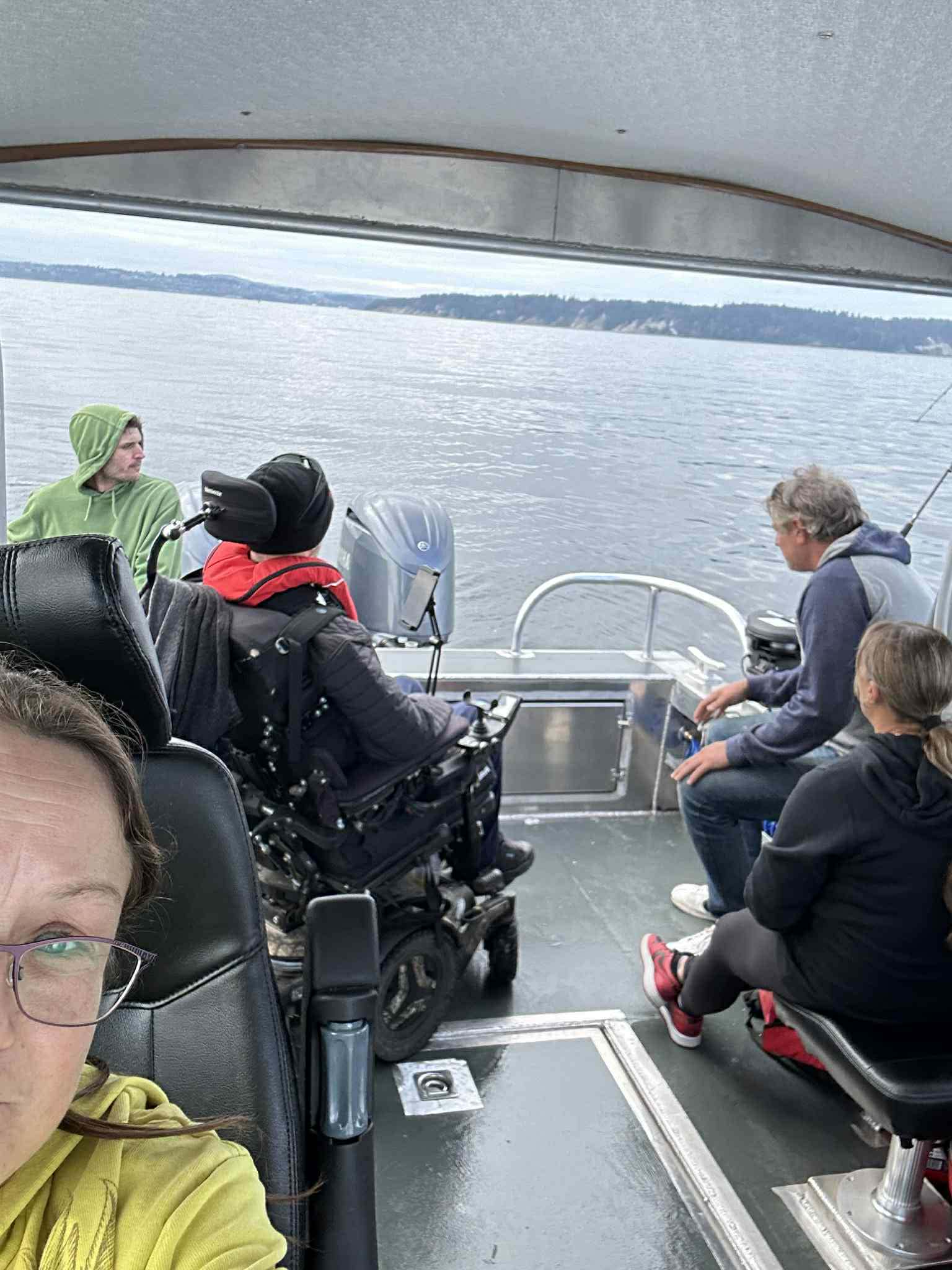 Guests enjoying an accessible fishing trip on the water