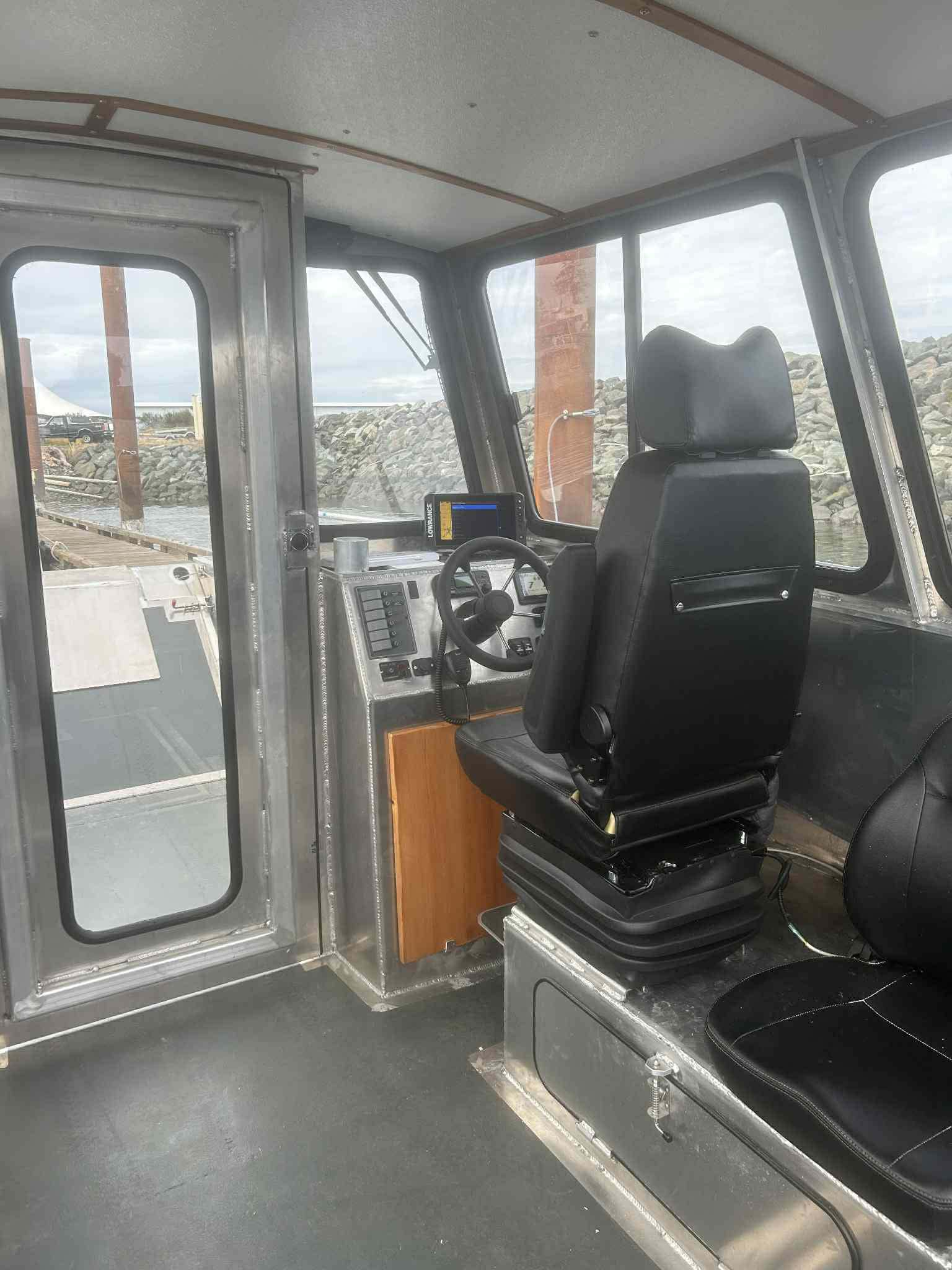 Wheelhouse and captain's chair inside the charter boat